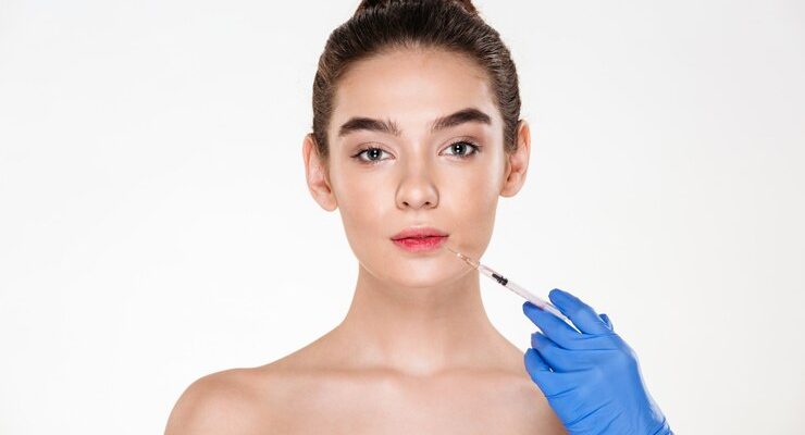 portrait-beautiful-woman-getting-injection-her-lips-with-botox-having-plastic-surgery-clinic_171337-677