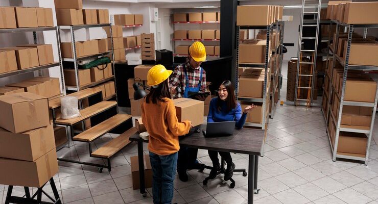 warehouse-package-handlers-doing-inventory-control-while-coworking-with-logistics-manager-asian-storehouse-employees-scanning-cardboard-box-creating-invoice-laptop_482257-71301