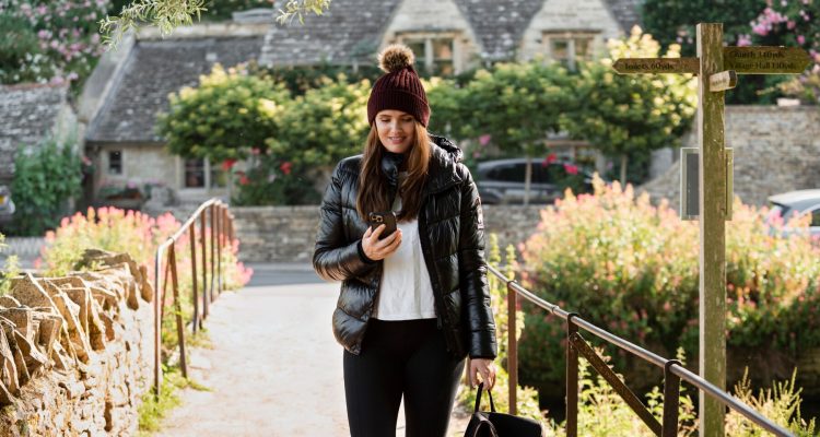 woman-checking-her-phone-while-traveling_23-2149084370