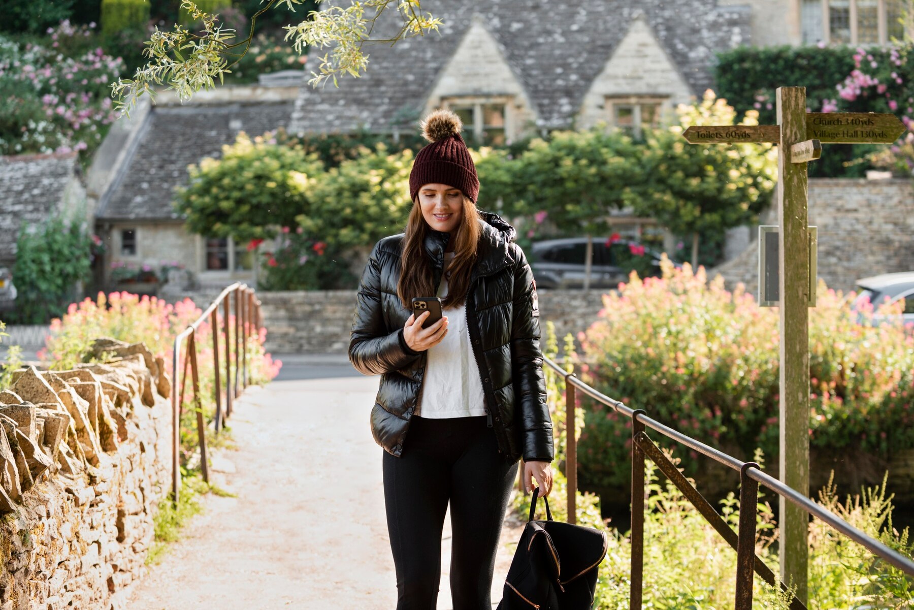 woman-checking-her-phone-while-traveling_23-2149084370