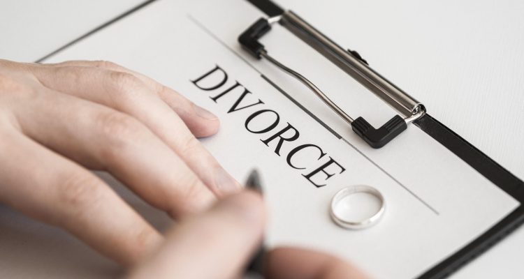 close-up-male-signing-divorce-contract