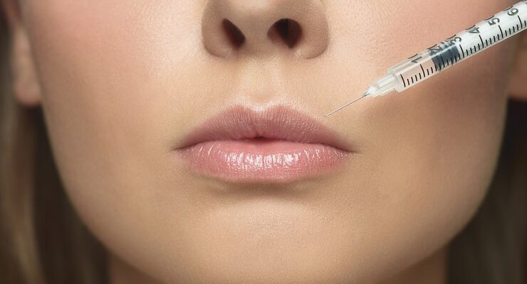 close-up-portrait-young-woman-white-studio-wall-filling-surgery-procedure-lip-augmentation_155003-35059