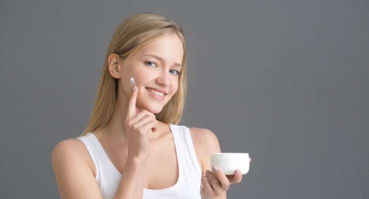 face-cream-woman-applying-crean-skin-natural-portrait-studio-shot_431835-996